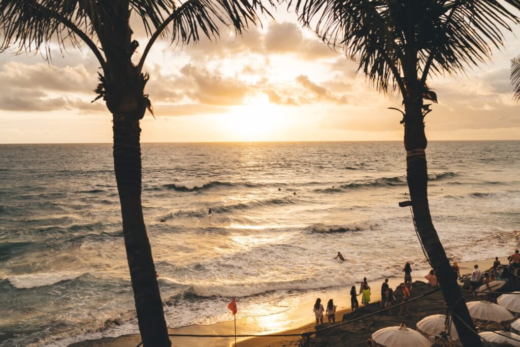 sunset beach seminyak bali ocean yellow sun