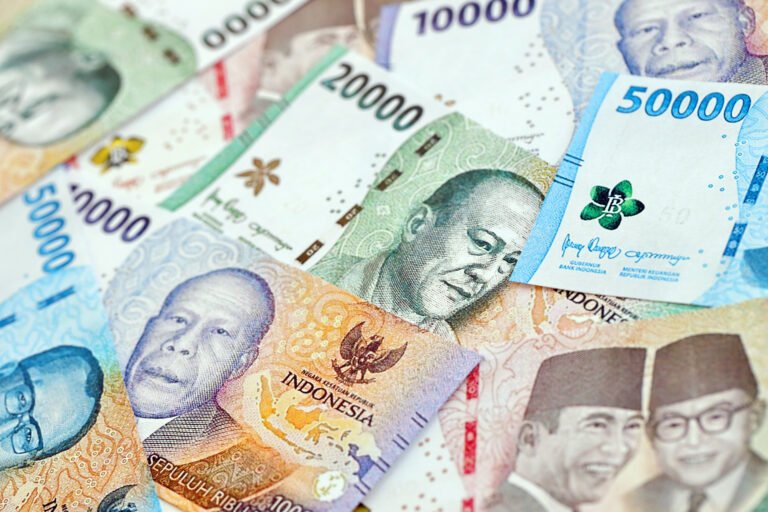 Background image of many indonesian rupiah money bills of new series