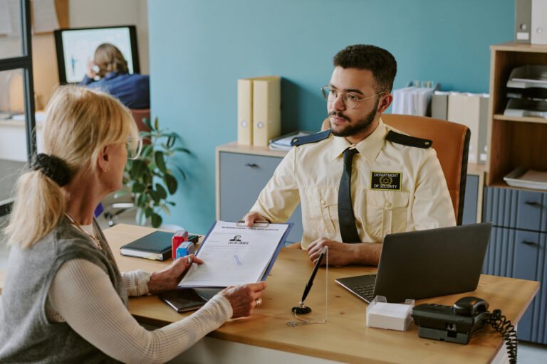 Discussing Visa Application With Security Officer