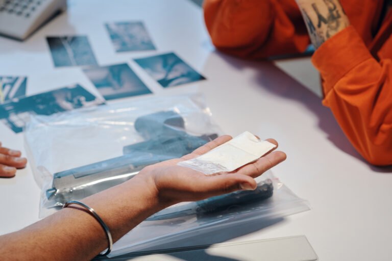 Detective Holding Bag of White Powder